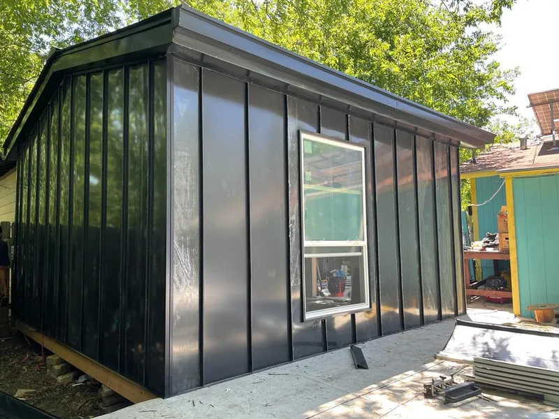 Black standing seam metal wall panels for Metal Roof Installation in Pelham