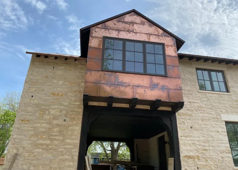 Copper metal panel facade on a stone building for Metal Roof Coating in Pelham